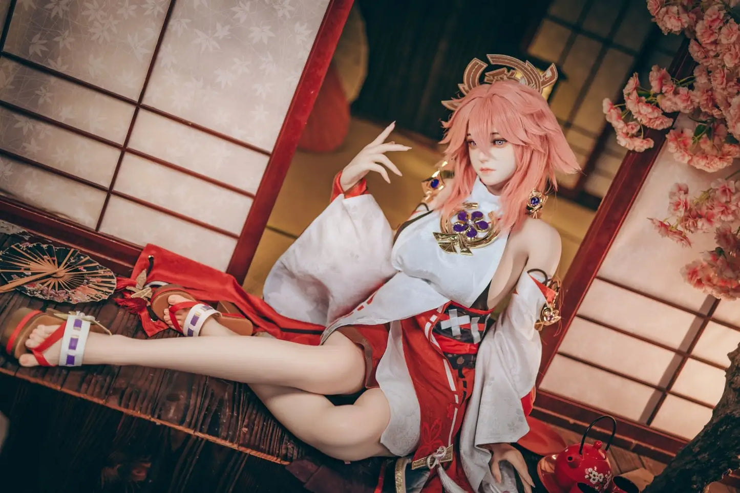  Yae Miko Genshin Impact cosplay sex doll, pink hair, sensual miko outfit, tatami room red cup – anime cosplay lifesize doll by TopLoveDoll,  red bell anklet, wooden geta sandals, Genshin Impact sex doll, sitting on the stairs, legs crossed, holding a J-style red cup, high-angle full shot, horizontal profile, doing a beautiful hand gesture