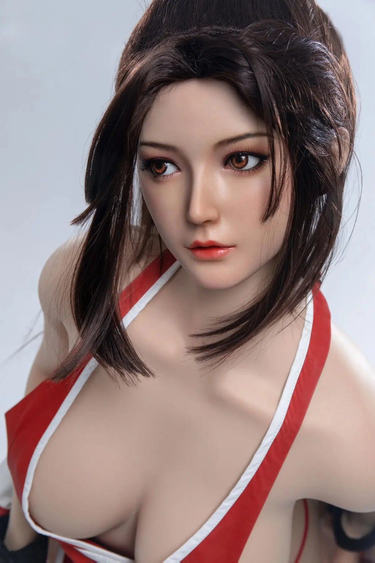 Aileen, long black hair, high ponytail with half-down hair, red Mai Shiranui signature kunoichi costume, sex AF, leaning forward and revealing her gorgeous curves, chest-level shot – cosplay sex doll by TopLoveDoll 