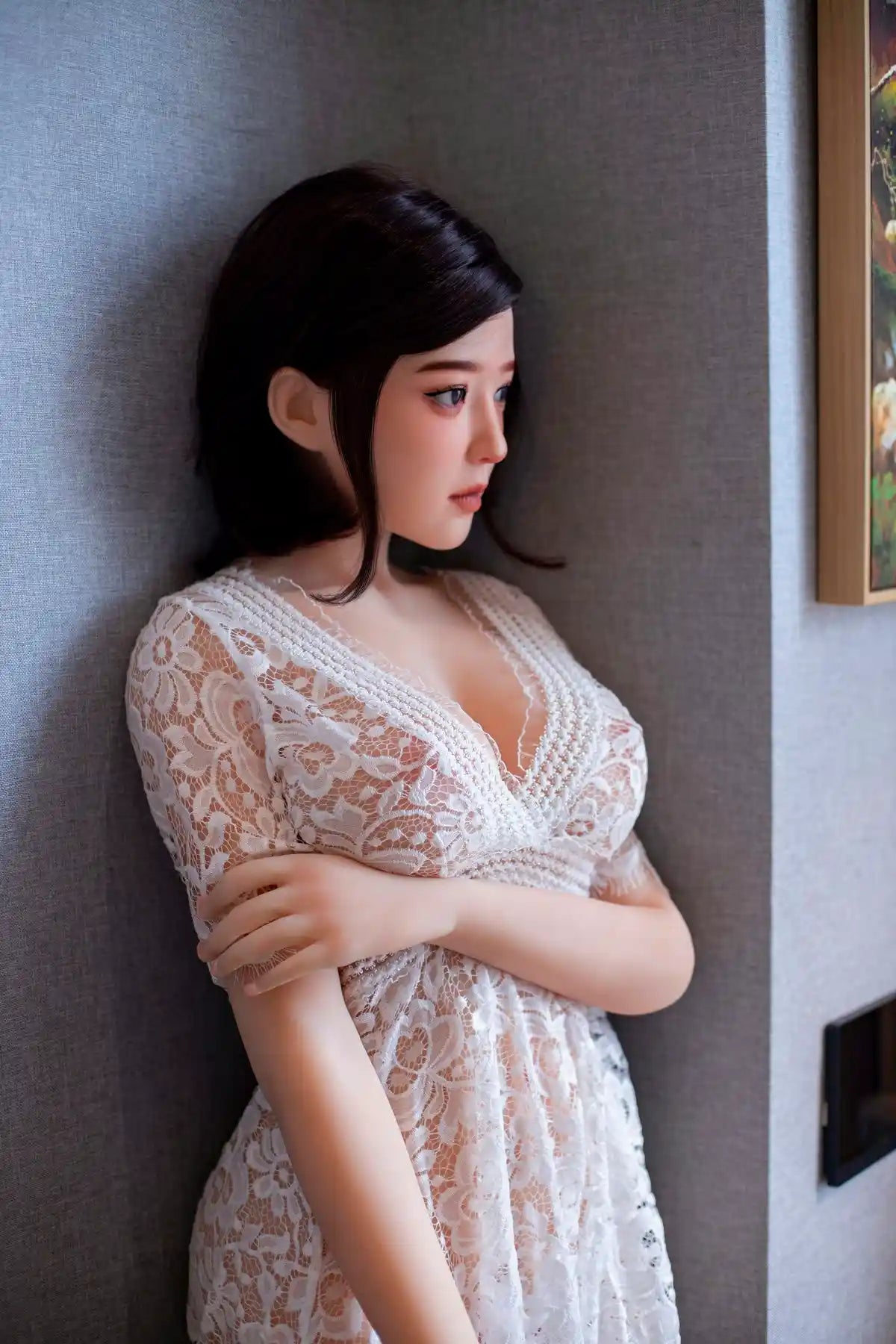 Aliza short dark bob, white lace dress, serene pose, indoor lighting, leaning against the wall,  perfectly combed hair– perfect wife Asian companion sex doll by TopLoveDoll