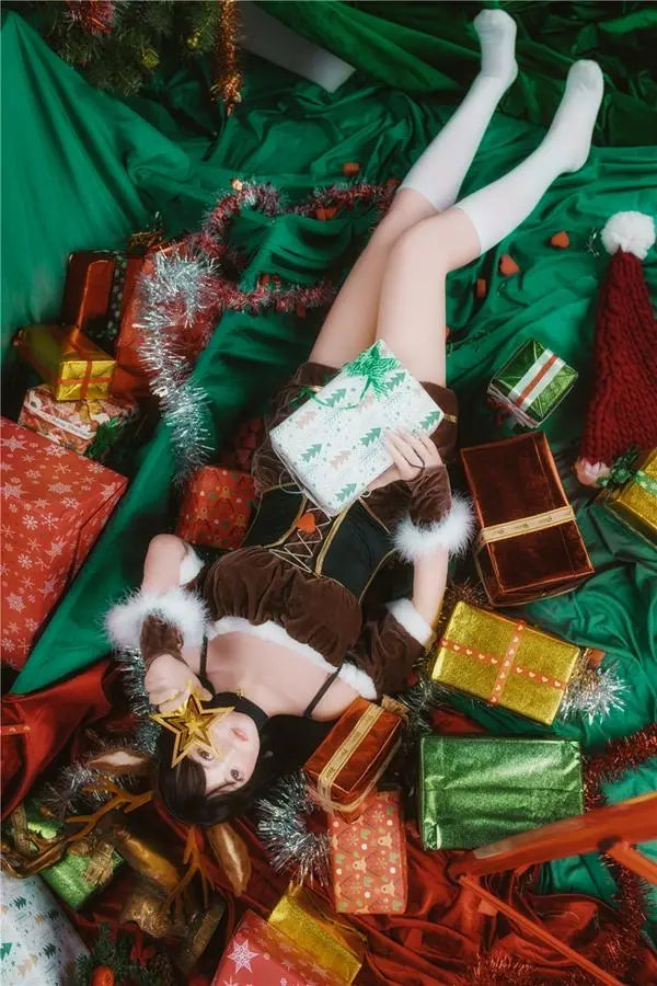 Amaris long black straight hair blunt bangs antler headband brown velvet top, Asian school goddess face Christmas red green background, cute asian girlfriend, lying among the gifts pile under Christmas tree – deer girl cosplay sex doll by TopLoveDoll