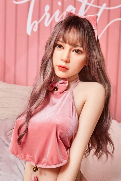 Amelia long wavy brown hair pink crop top pink mini skirt Y2K sweetgirl sitting in pink room soft Asian companion, sitting on a pink chair wearing pink lingerie set, everything is pinkie pinky, pink lifestyle, close up– girl-next-door sex doll by TopLoveDoll