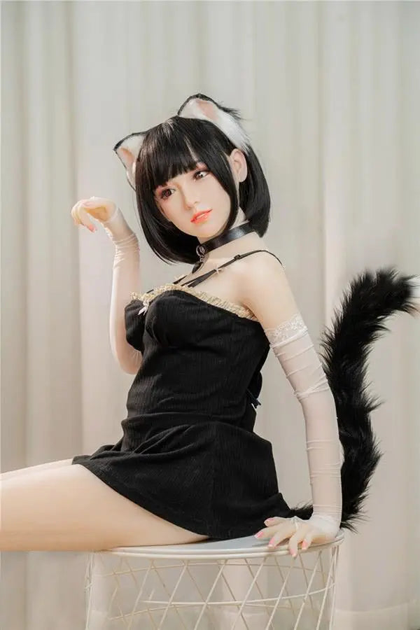 Amelie short black hair cat ears tail collar black bodysuit soft round face Asian catgirl full cosplay set, asian waifu catgirl cosplay, fun night for you, sitting and doing the meow gesture – anime companion sex doll by TopLoveDoll