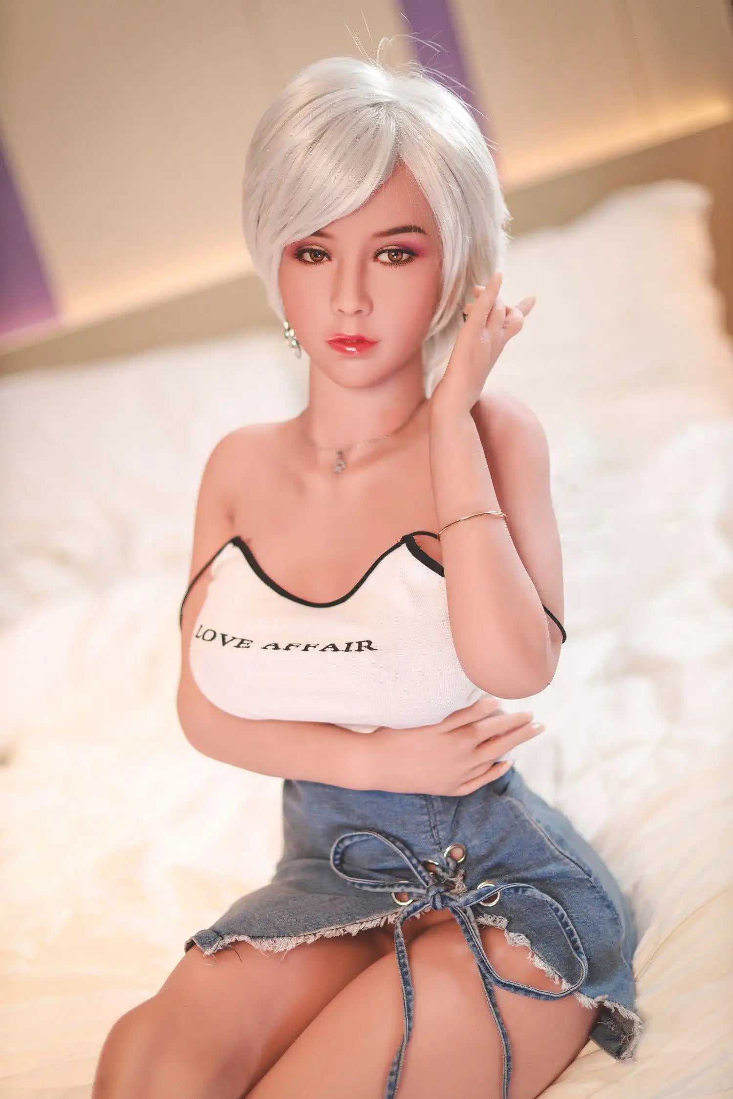 Anahi short platinum blonde hair tan skin white fitted tank denim micro skirt bold Shibuya street style pose, sitting on the hotel bed, bust shot – Asian blonde pornstar sex doll by TopLoveDoll