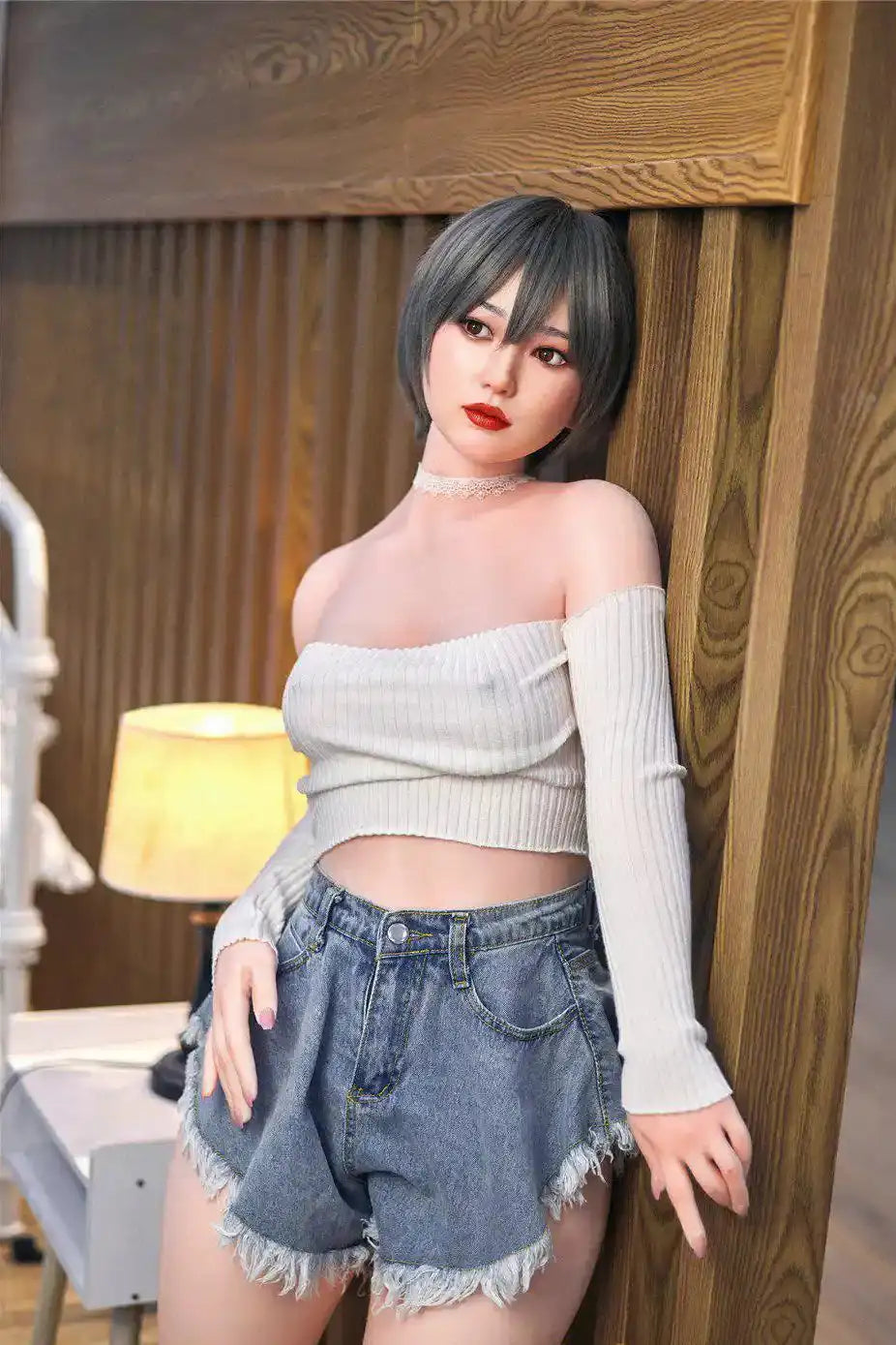 Anya next door sister Asian sex doll - grey bob red lip off-shoulder crop top denim shorts soft figure by TopLoveDoll,  leaning against a wooden wall