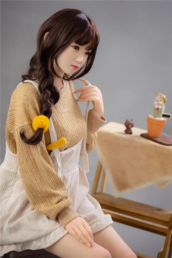 Astrid Asian bangs college sweetheart sex doll, sitting on the chair, looking like she's in deep-thinking- first love high school girl next door by TopLoveDoll