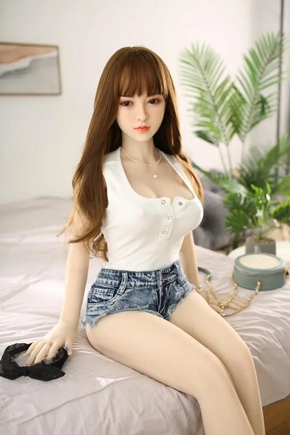 Aubree bangs Asian sweet girl next door sex doll, sitting on bed- cozy home backwards chair natural sweetness by TopLoveDoll
