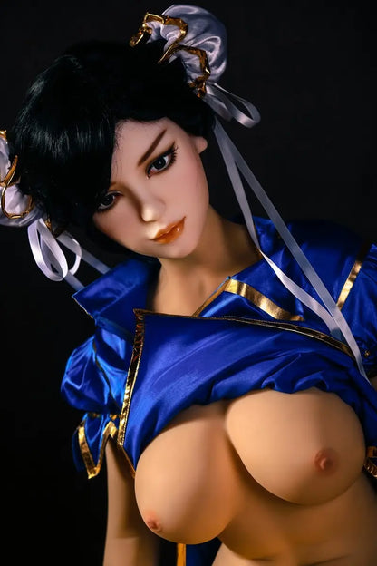 Aubriella Street Fighter Chun-Li cosplay sex doll in blue qipao on a black background, close up of the half naked sex doll, showing the side curves of her breasts, looking puzzled- iconic blue qipao fighter fantasy by TopLoveDoll