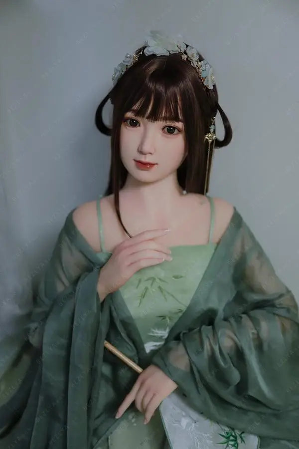 Autumn hanfu Asian girl next door sex doll, in green hanfu attire, ancient chinese hairstyle, standing, on a grayish white background, traditional Chinese dress jade green beauty by TopLoveDoll